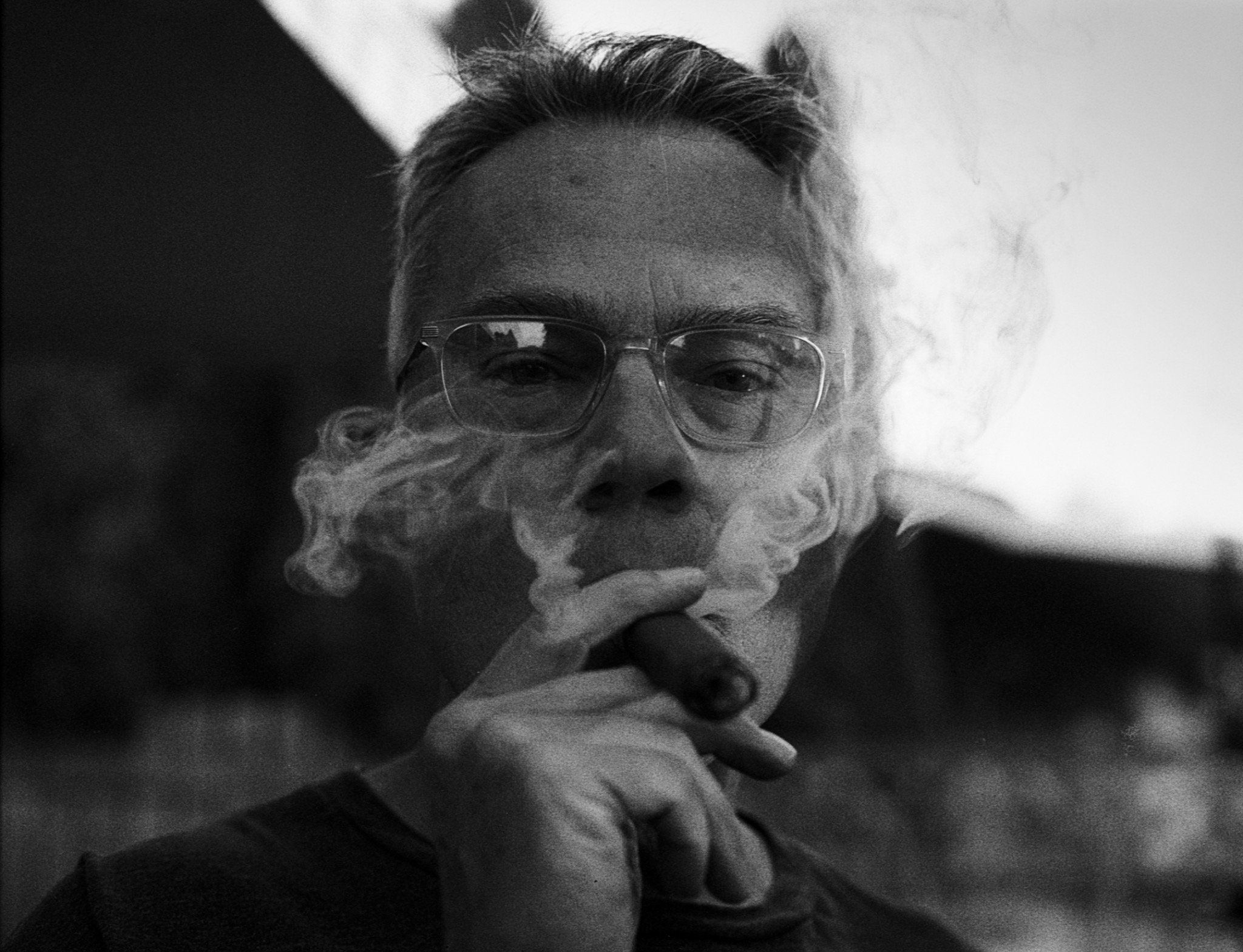 Black and white portrait of Hank with a cigar